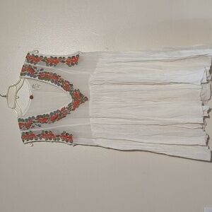 Free People One with embroidered around the neckline and arm size XS oversize